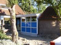 Aanbouw tussen woning en berging