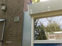 Aanbouw tussen woning en berging