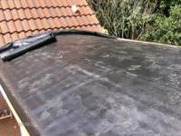 Aanbouw tussen woning en berging