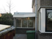 Aanbouw achter garage en bestaande garage verhogen